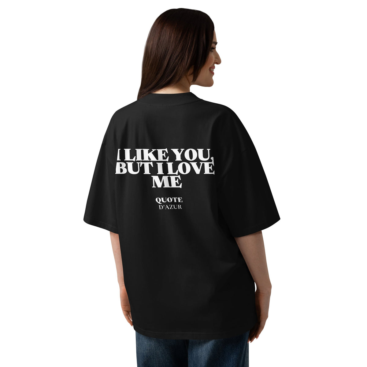 I Like You, but I Love Me – Oversized T-Shirt in Black, back view on a female model.