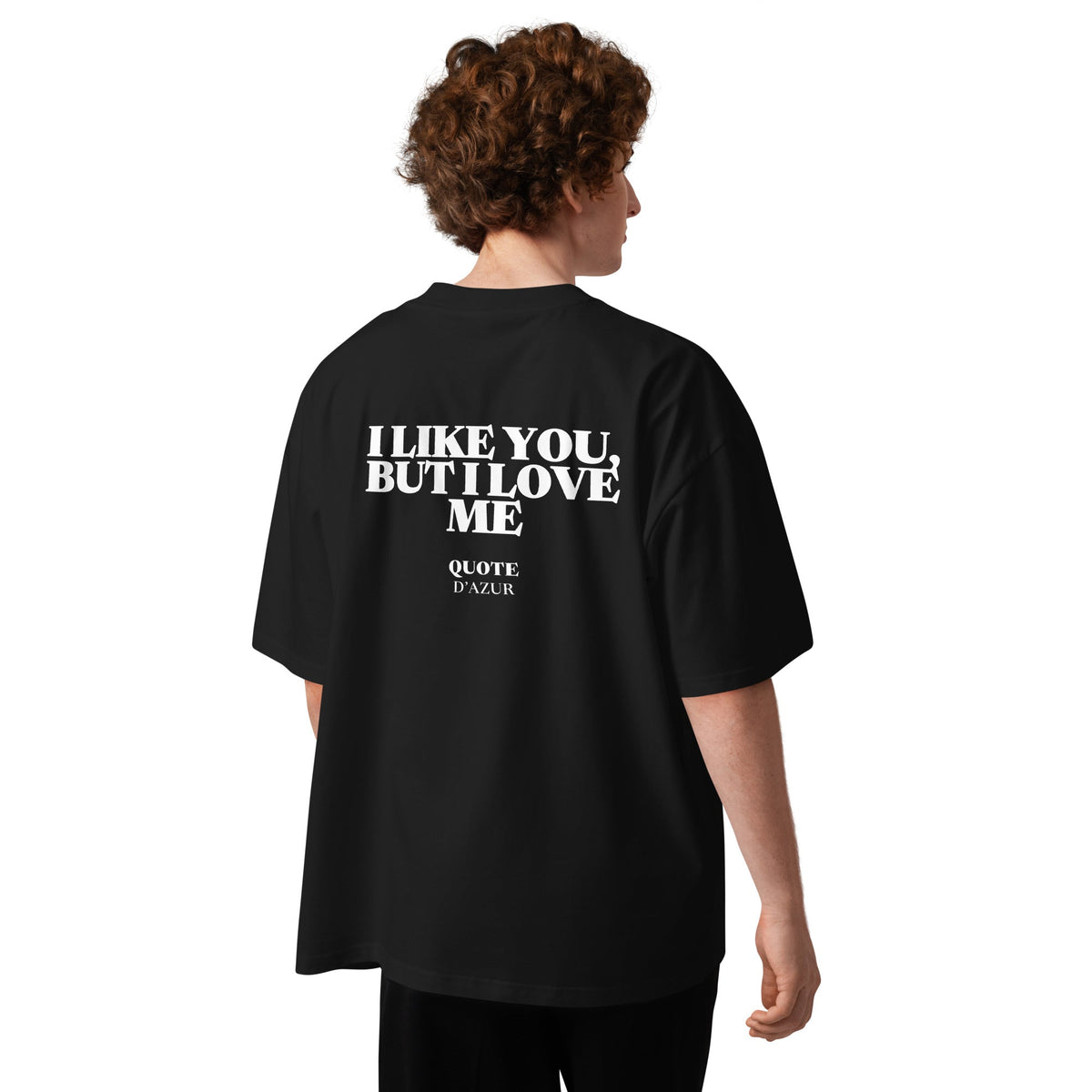 I Like You, but I Love Me – Oversized T-Shirt in Black, back view on a male model.