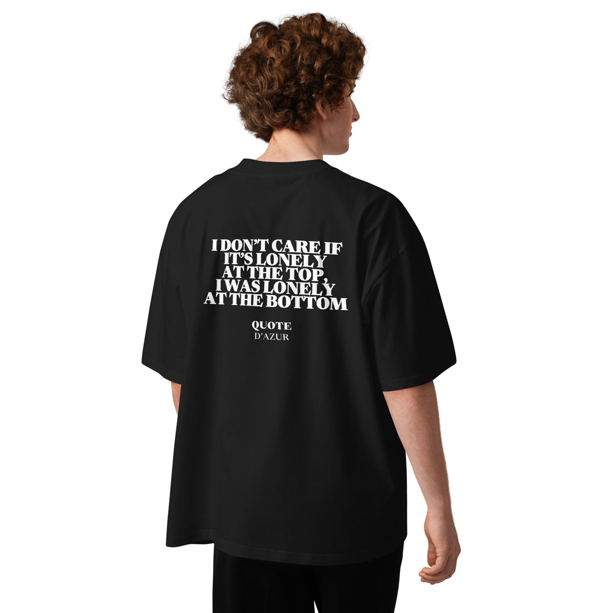 I Don’t Care If It’s Lonely at the Top, I Was Lonely at the Bottom – Oversized T-Shirt in Black, back view on a male model.