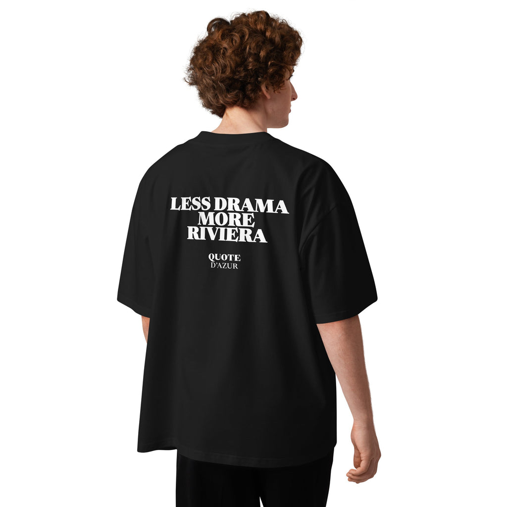 Less Drama, More Riviera – Oversized T-Shirt in Black, back view on a male model.