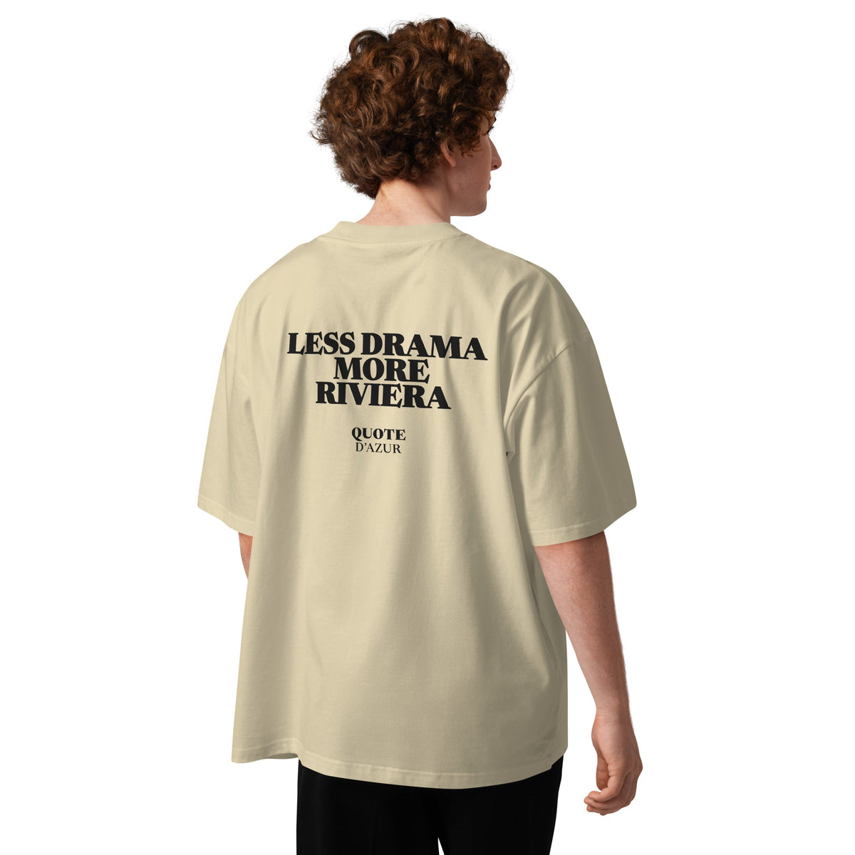 Less Drama, More Riviera – Oversized T-Shirt in Stone, back view on a male model.
