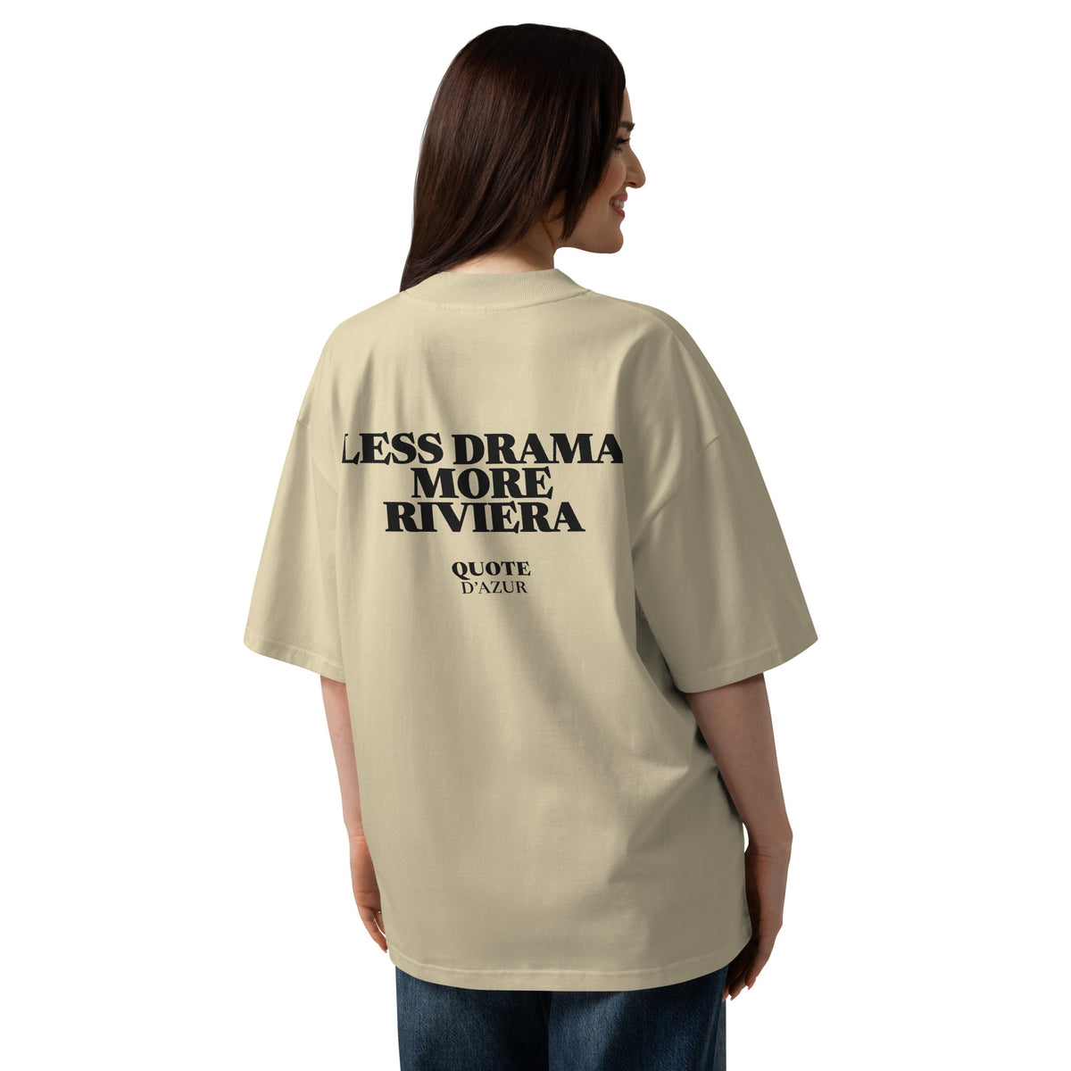 Less Drama, More Riviera – Oversized T-Shirt in Stone, back view on a female model.