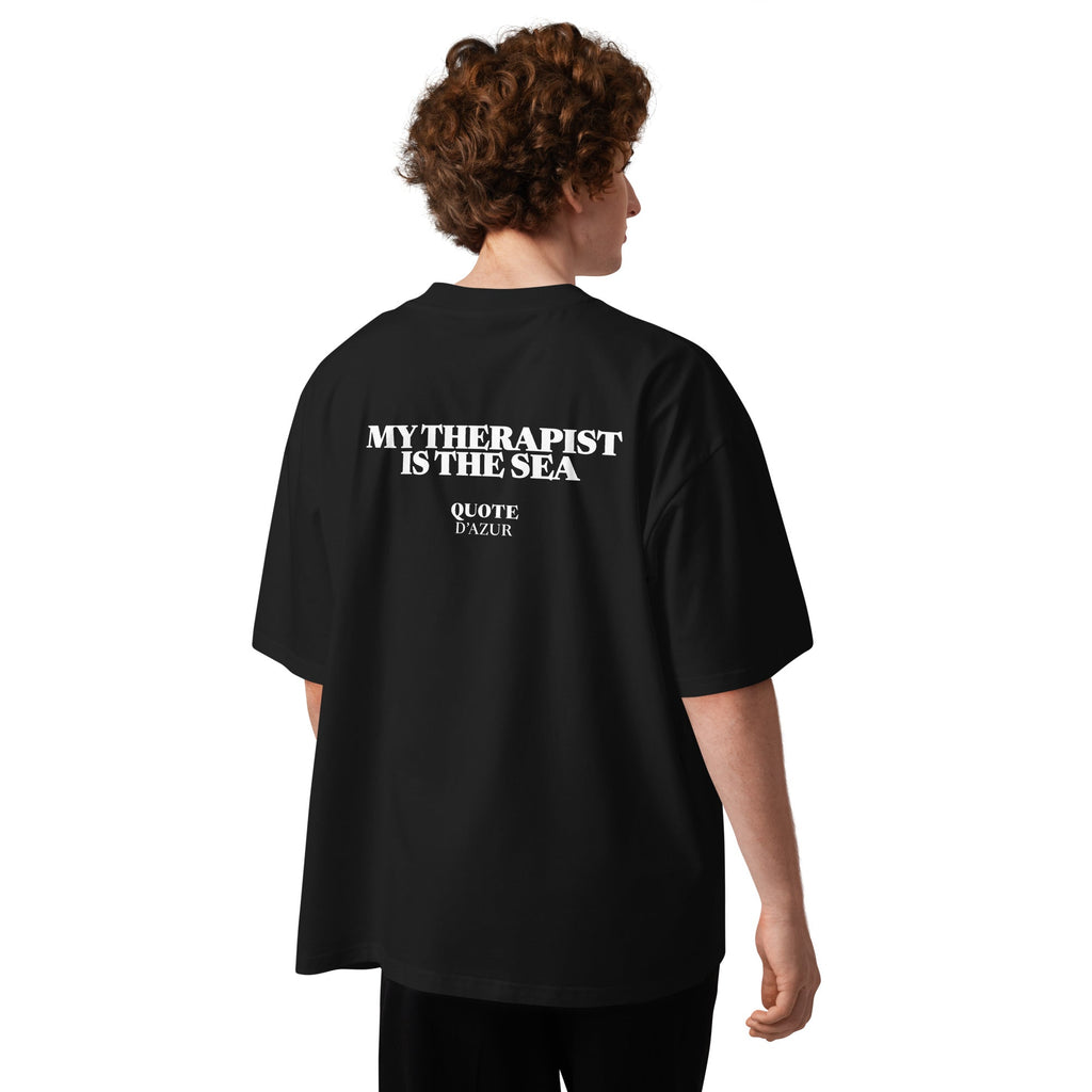 My Therapist Is the Sea – Oversized T-Shirt in Black, back view on a male model.