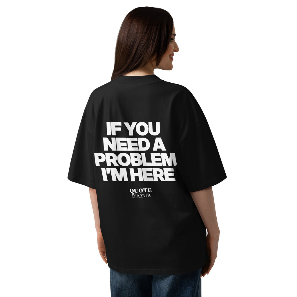 If You Need a Problem, I’m Here – Oversized T-Shirt in Black, back view on a female model.