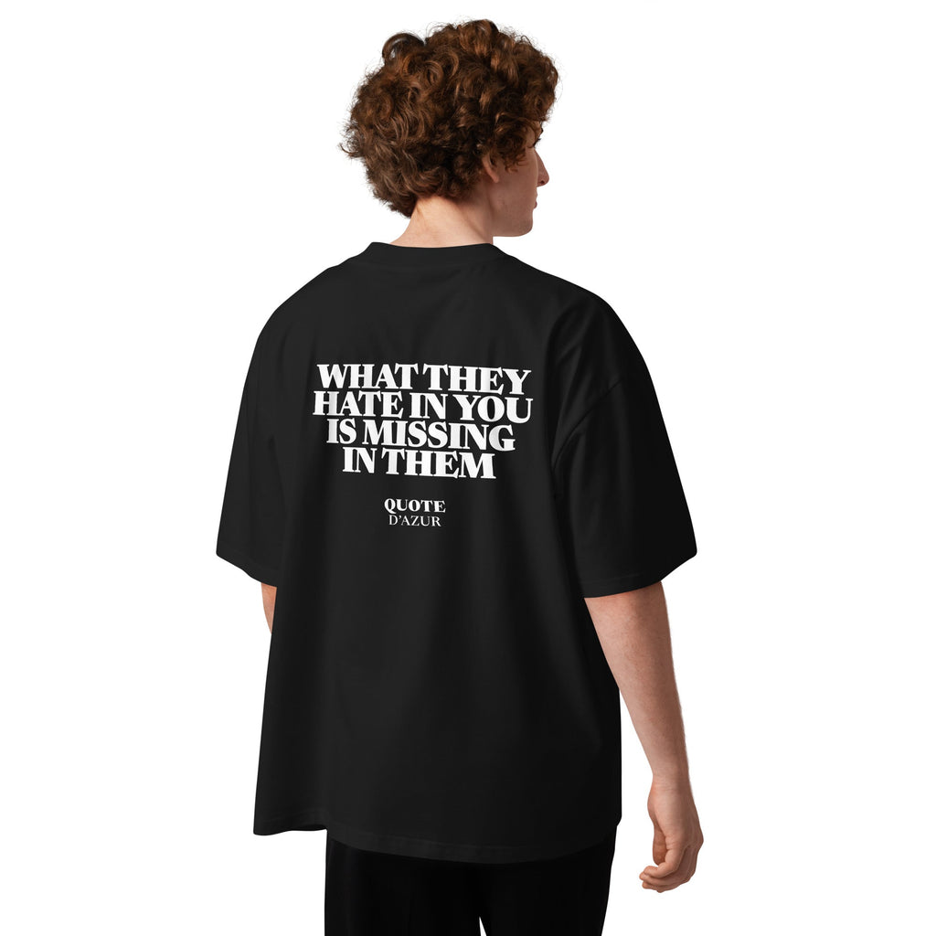 What They Hate in You Is Missing in Them – Oversized T-Shirt in Black, back view on a male model.
