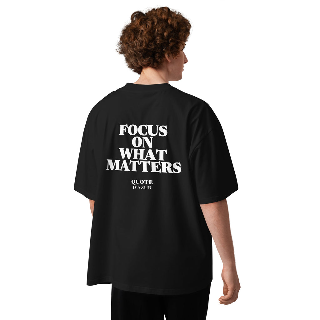 Focus on What Matters – Oversized T-Shirt in Black, back view on a male model.