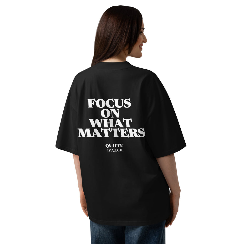 Focus on What Matters – Oversized T-Shirt in Black, back view on a female model.