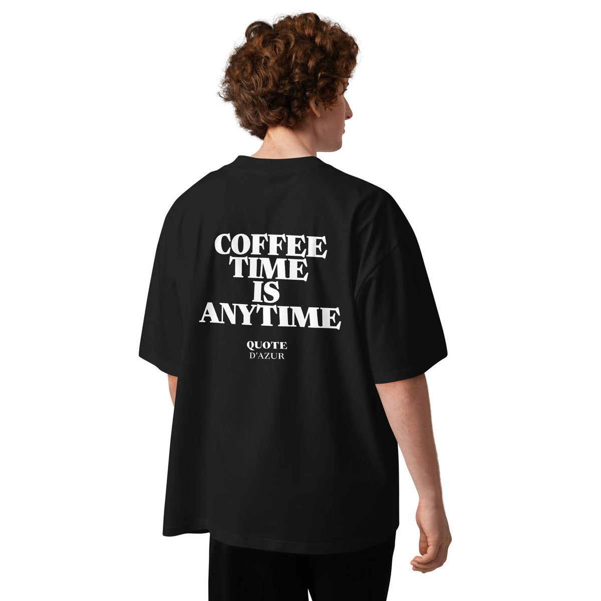 Coffee Time Is Anytime – Oversized T-Shirt in Black, back view on a male model.