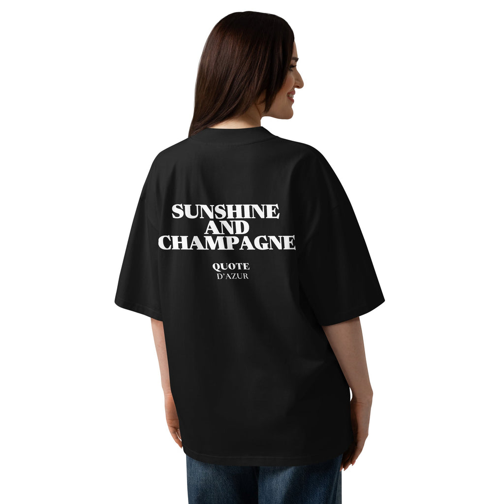 Sunshine and Champagne – Oversized T-Shirt in Black, back view on a female model.
