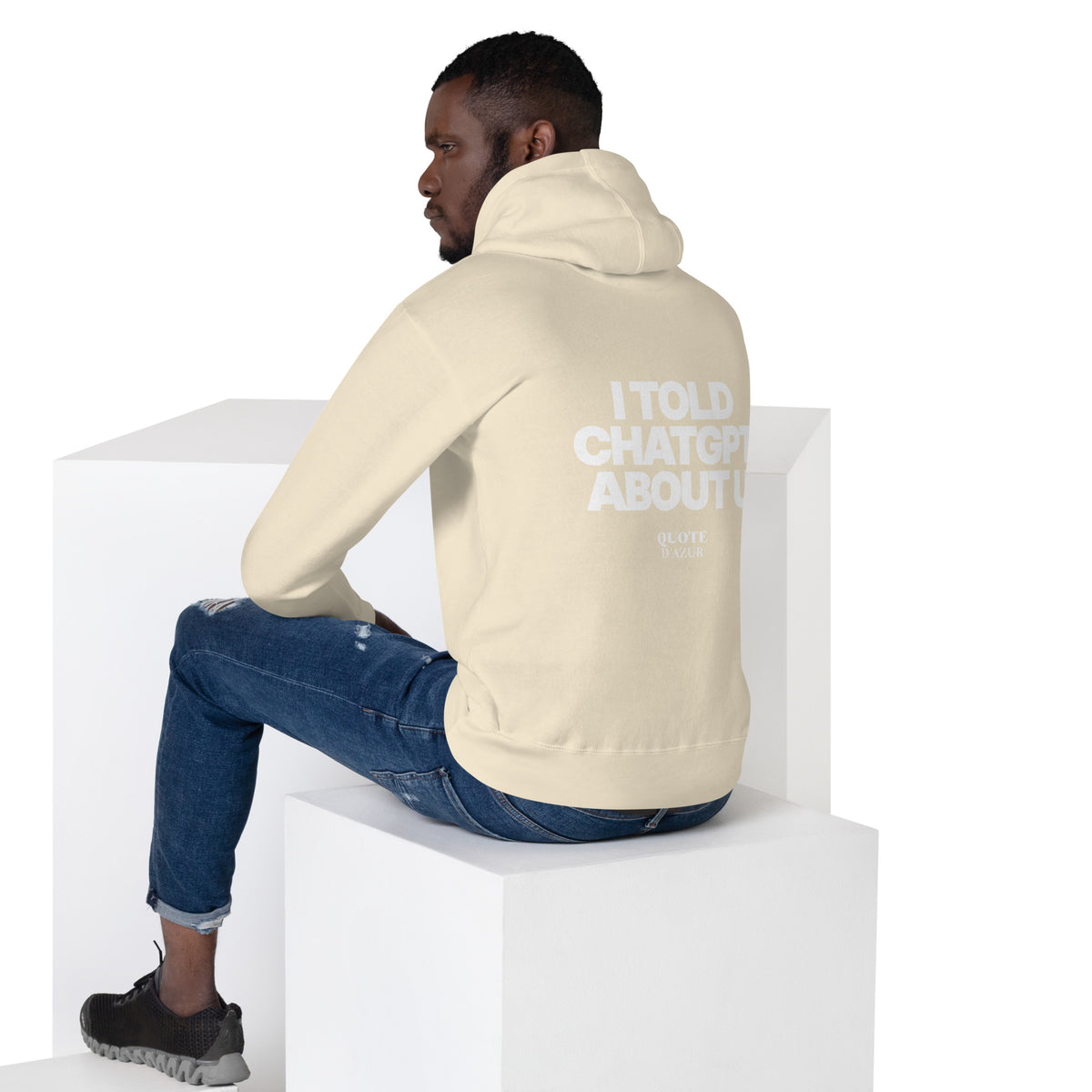 QUOTE D’AZUR I Told ChatGPT About U hoodie, Bone, back view – product mockup (men lifestyle)